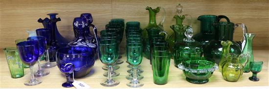 Two glass eye baths, a collection of other green and blue glassware, some enamelled and a small Caithness vase